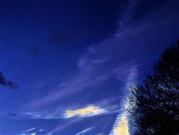 Low angle view of vapor trail in blue sky
