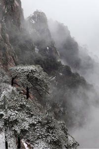 Scenic view of mountains against sky during winter