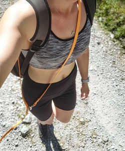 Low section of woman walking on street