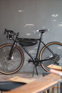 Bicycle parked against wall