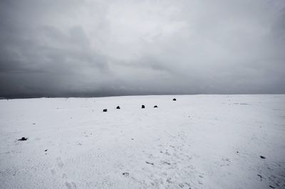 Scenic view of sea against cloudy sky