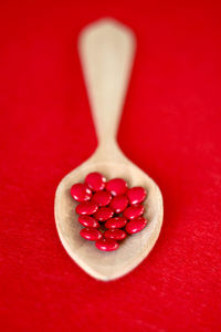 Directly above shot of red berries on table