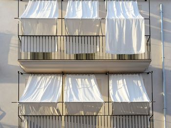 Close-up of clothes hanging on window