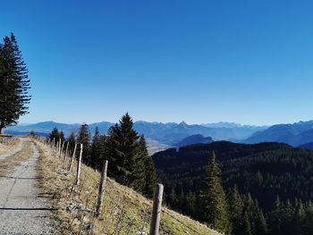 Scenic view of mountains against clear blue sky