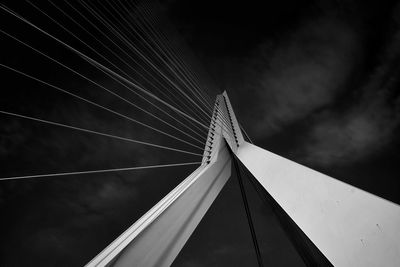 Low angle view of suspension bridge against sky