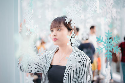 Portrait of young woman looking away