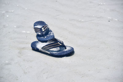 High angle view of shoes on sand