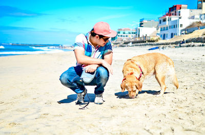 Man with dog on beach