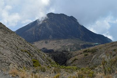 Scenic mountain landscapes against sky in  mount meru, arusha national park, tanzania