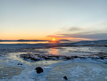 Scenic view of sea against sky during sunset