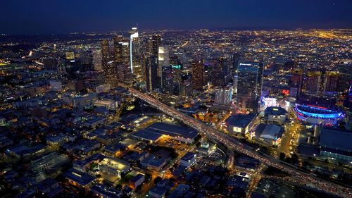 Illuminated cityscape at night,los angeles drone view of downtown skyline