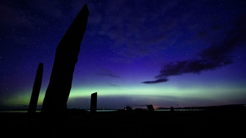 Silhouette built structure against sky at night