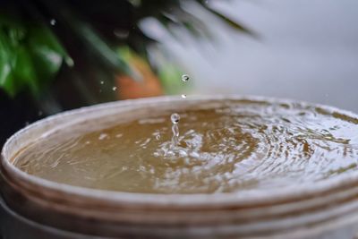 Close-up of water splashing in glass