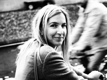 Close-up portrait of smiling young woman