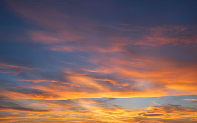 Low angle view of dramatic sky during sunset