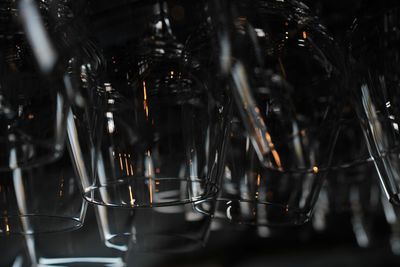 Close-up of wineglasses against black background