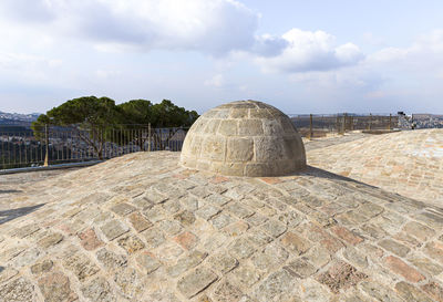 Stone structure against sky