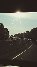 Road seen through car windshield