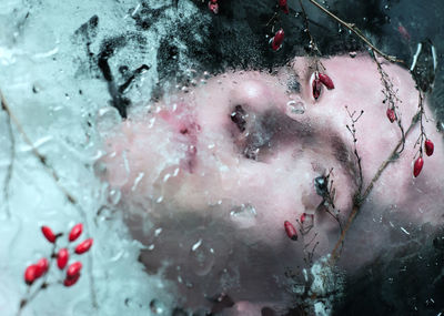 Close-up of man in frozen water