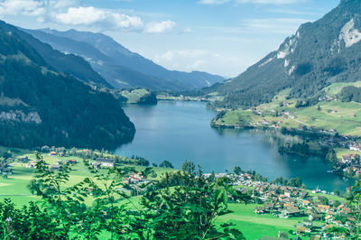 Scenic view of lake and mountains against sky