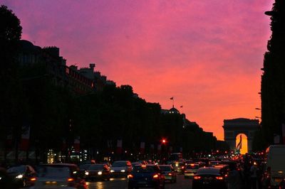 Traffic on road at sunset