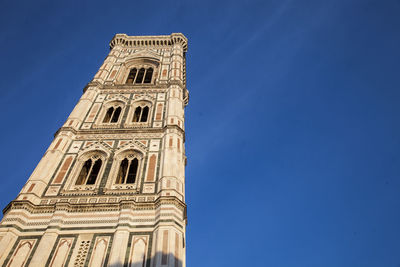 Low angle view of building against blue sky