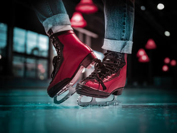 Low section of woman in ice skate