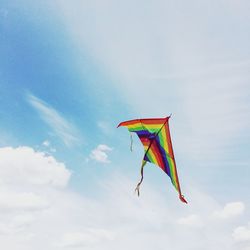 Low angle view of kite flying against sky