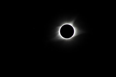 Low angle view of silhouette moon against sky at night