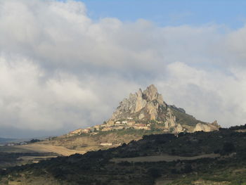 View of mountain range against cloudy sky