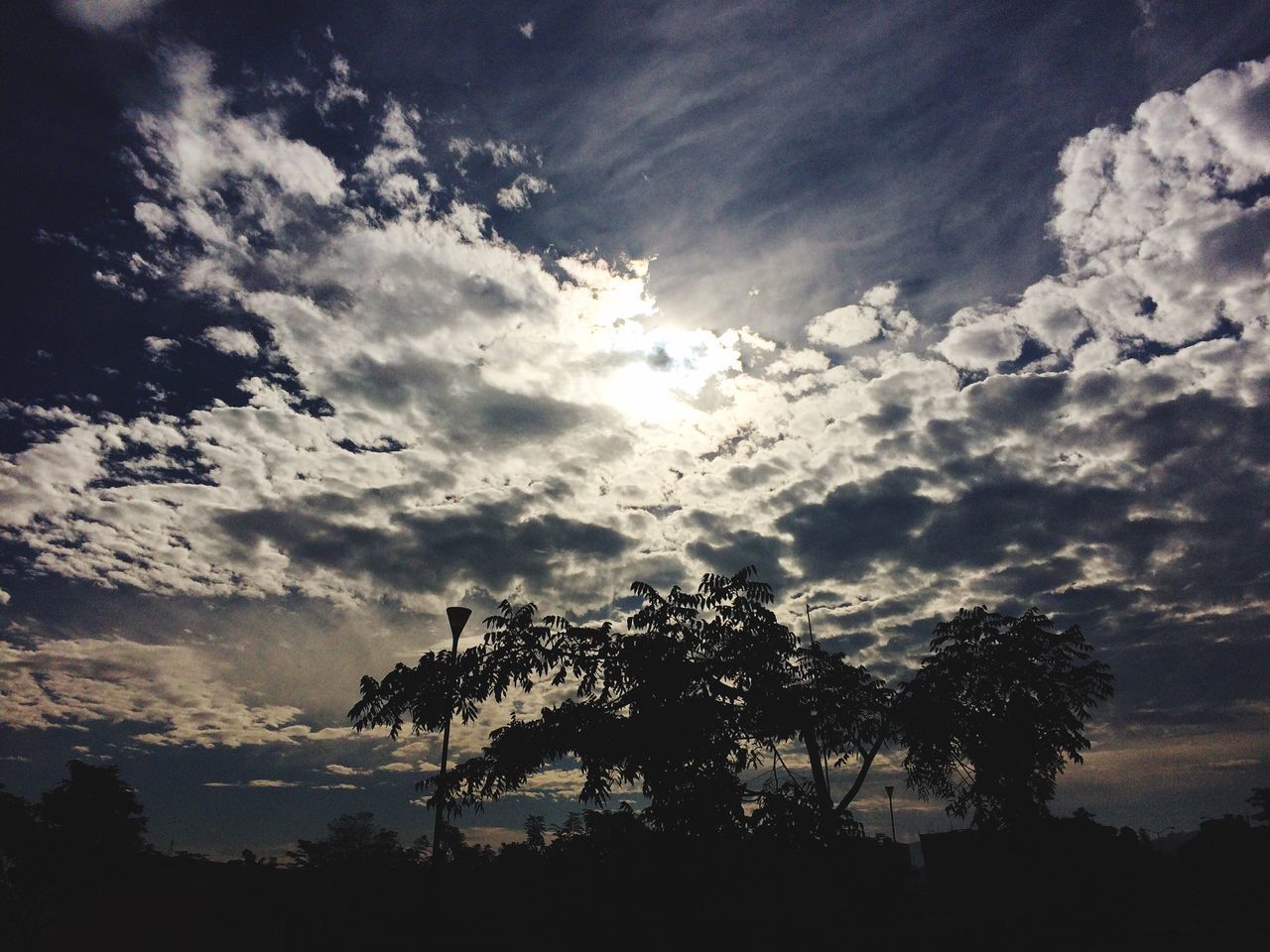 silhouette, sky, tranquility, scenics, tranquil scene, beauty in nature, tree, cloud - sky, nature, idyllic, cloudy, sunset, landscape, cloud, outdoors, low angle view, no people, non-urban scene, dusk, sunlight