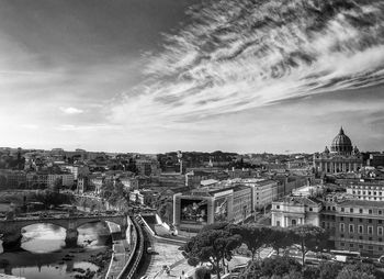 Cityscape against cloudy sky