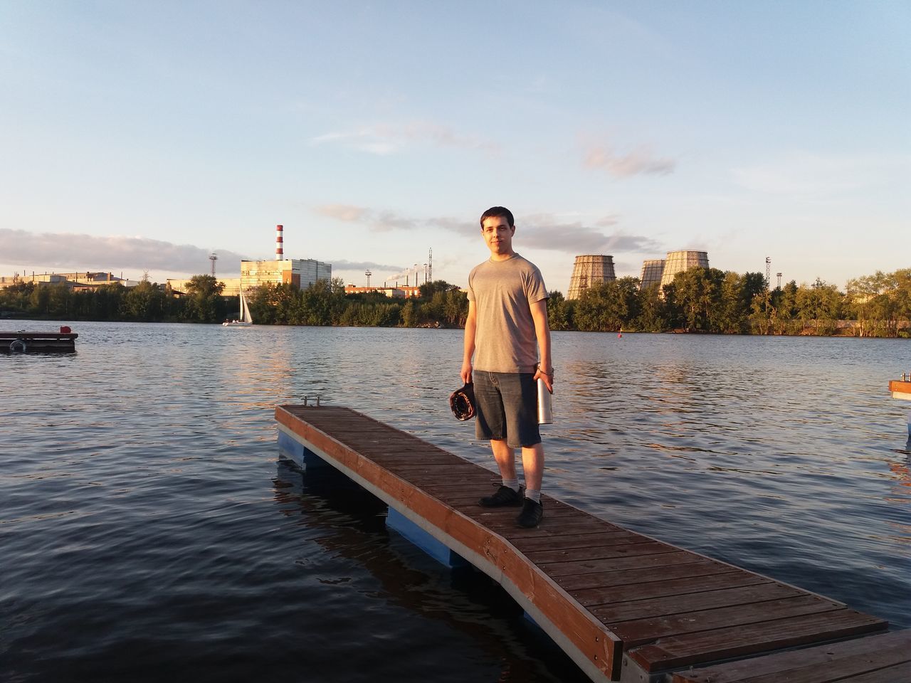 FULL LENGTH OF MAN STANDING ON RIVER AGAINST SKY