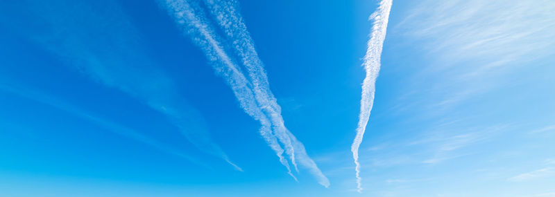 Low angle view of vapor trails in sky