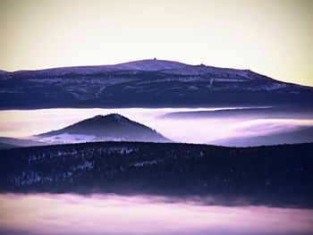 Scenic view of mountains against sky during sunset