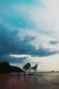 Scenic view of sea against cloudy sky