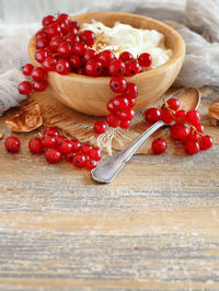 High angle view of strawberries in bowl on table