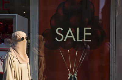 Text on glass window of store