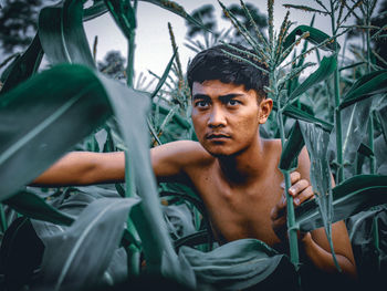 Portrait of young man looking away