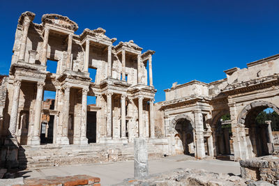 View of old ruins against clear blue sky