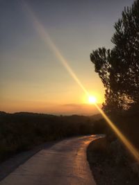 Empty road at sunset