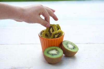 Close-up of hand holding fruits