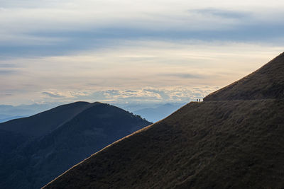 Trekking scene in lake como alps at sunset