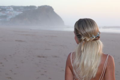 Rear view of woman looking at sea