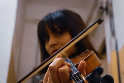 Young woman playing violin