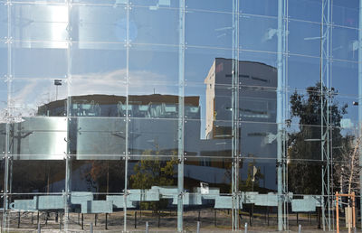 Reflection of building on glass window