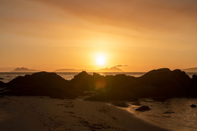 Scenic view of mountains against sky during sunset