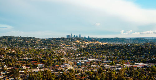 High angle view of city against cloudy sky