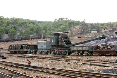 Train on railroad track against sky