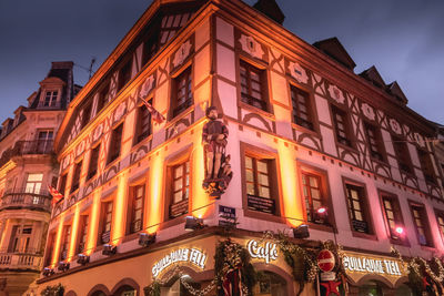 Low angle view of illuminated building at night